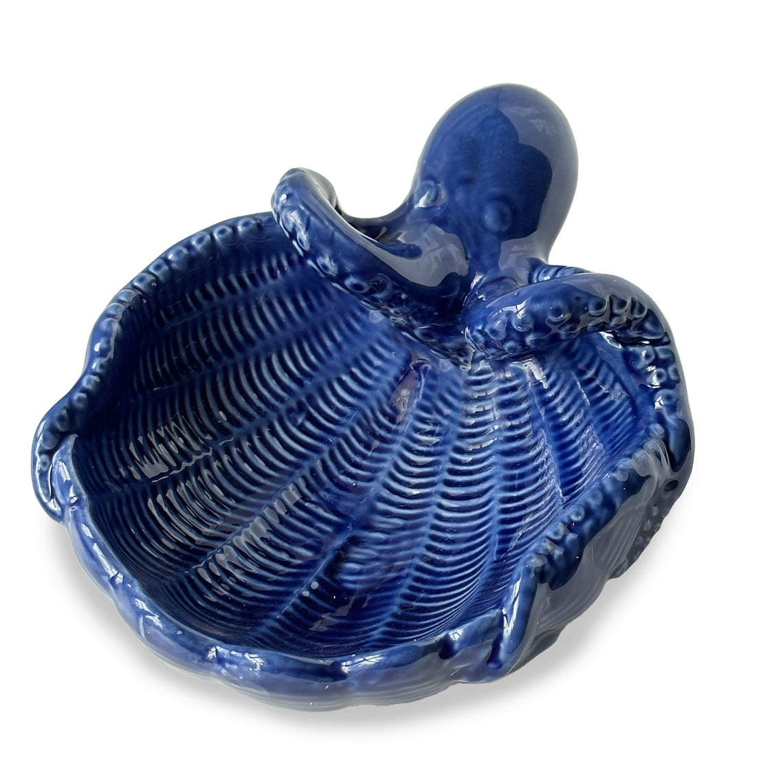 Detailed view of blue ceramic trinket dish with octopus accent and ribbed seashell design