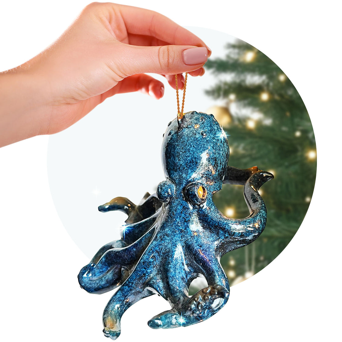 rengöra octopus ornament held by a hand with a golden string, against the blurred backdrop of a decorated Christmas tree