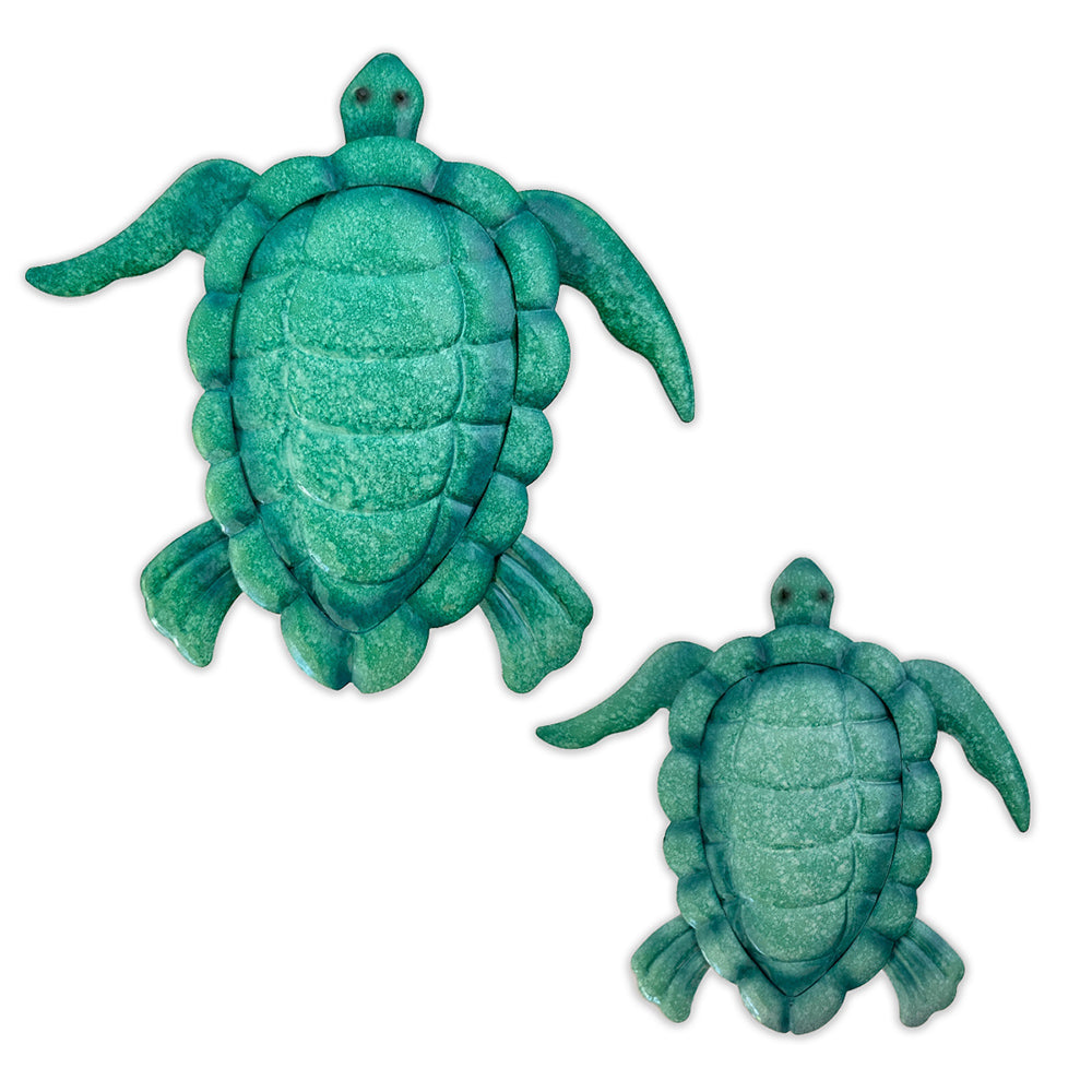 Set of two green enameled metal sea turtle wall art pieces shown on white background, perfect for beach-themed decor