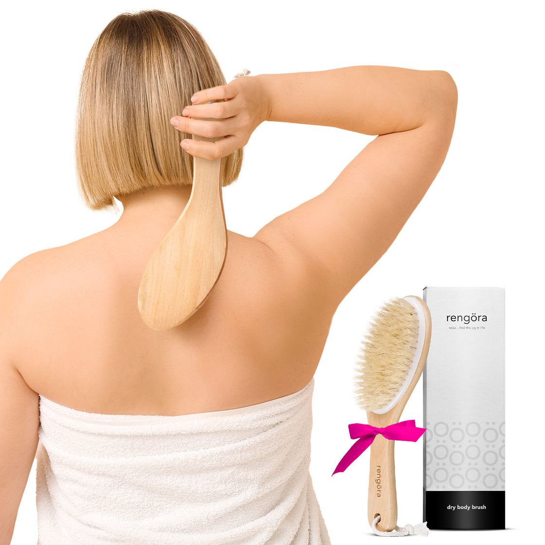 Hand holding Rengöra cherry wood dry brush with ergonomic 9.75-inch handle; bristles shown for gentle exfoliation and glowing skin.
