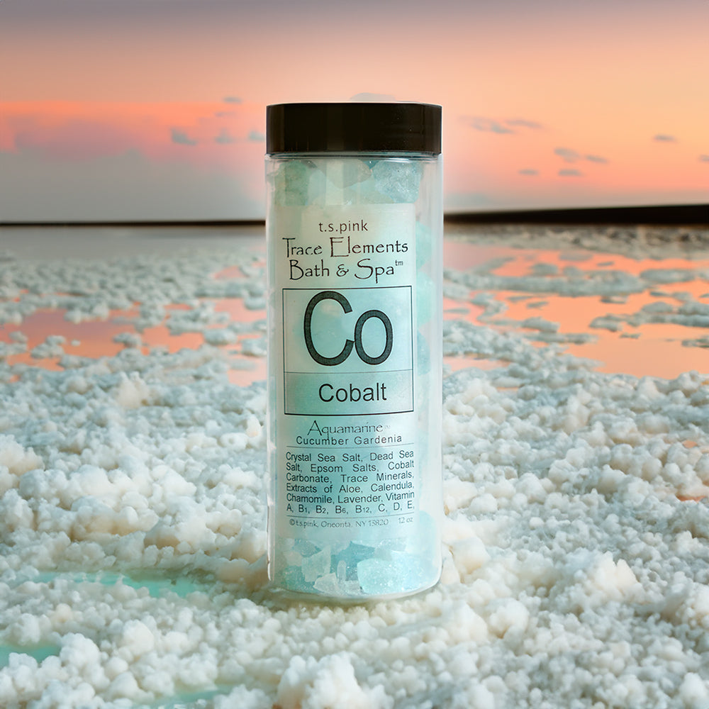 Cobalt crystal bath salts shown on an imaginary salt sea with a beautiful sunset skyline behind it