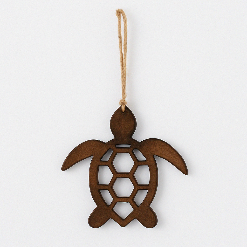 Studio image of wooden sea turtle ornament on a white background, showing its geometric cutout shell design and jute rope for hanging.