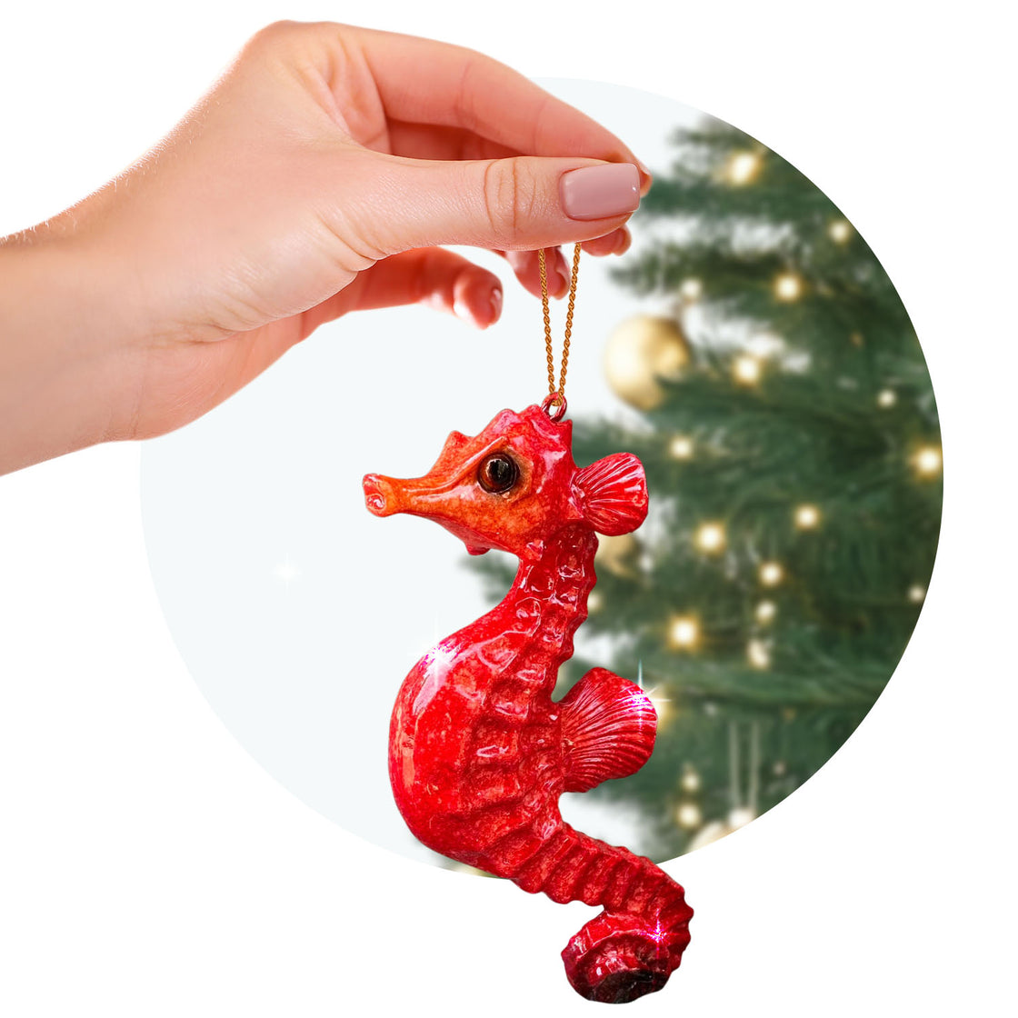 rengöra red seahorse ornament held by a hand with a golden string, against the blurred backdrop of a decorated Christmas tree