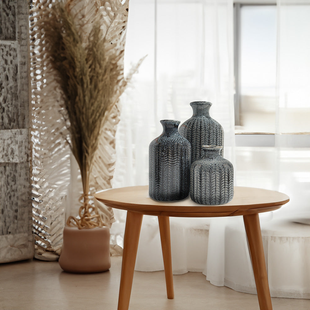 trio of vases elegantly arranged on the table
