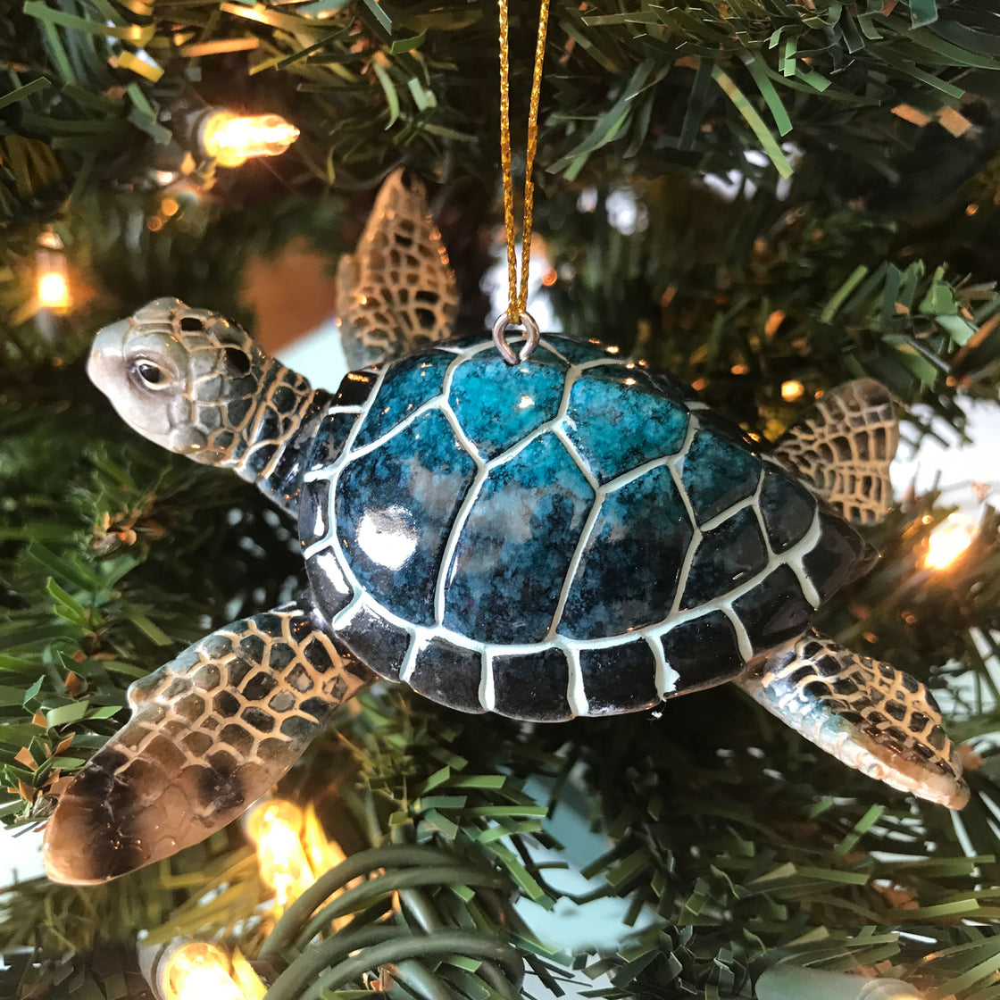 adorable hand-painted blue sea turtle ceramic ornament hanging on Christmas tree
