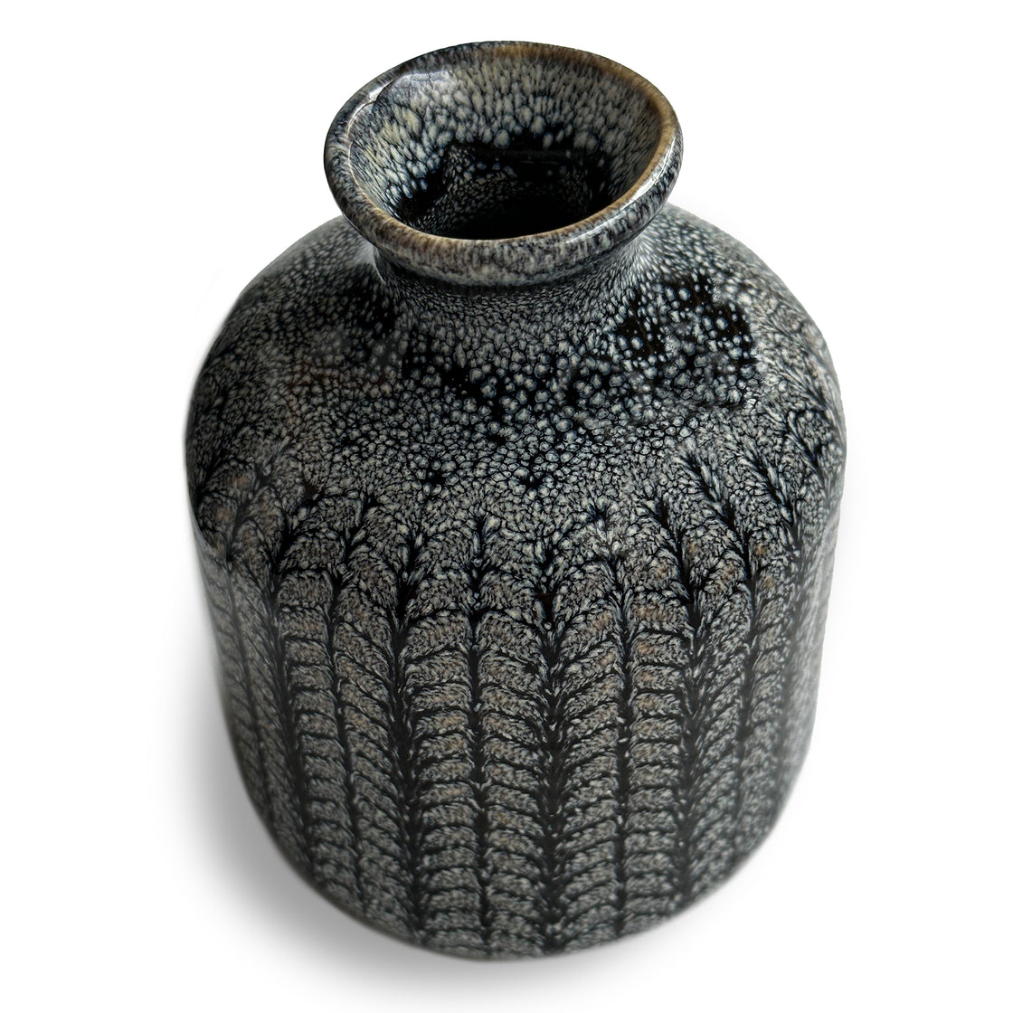 An up-close view of the vase taking inspiration from the depths of the ocean and crafted with meticulous elegance set against a pristine white background