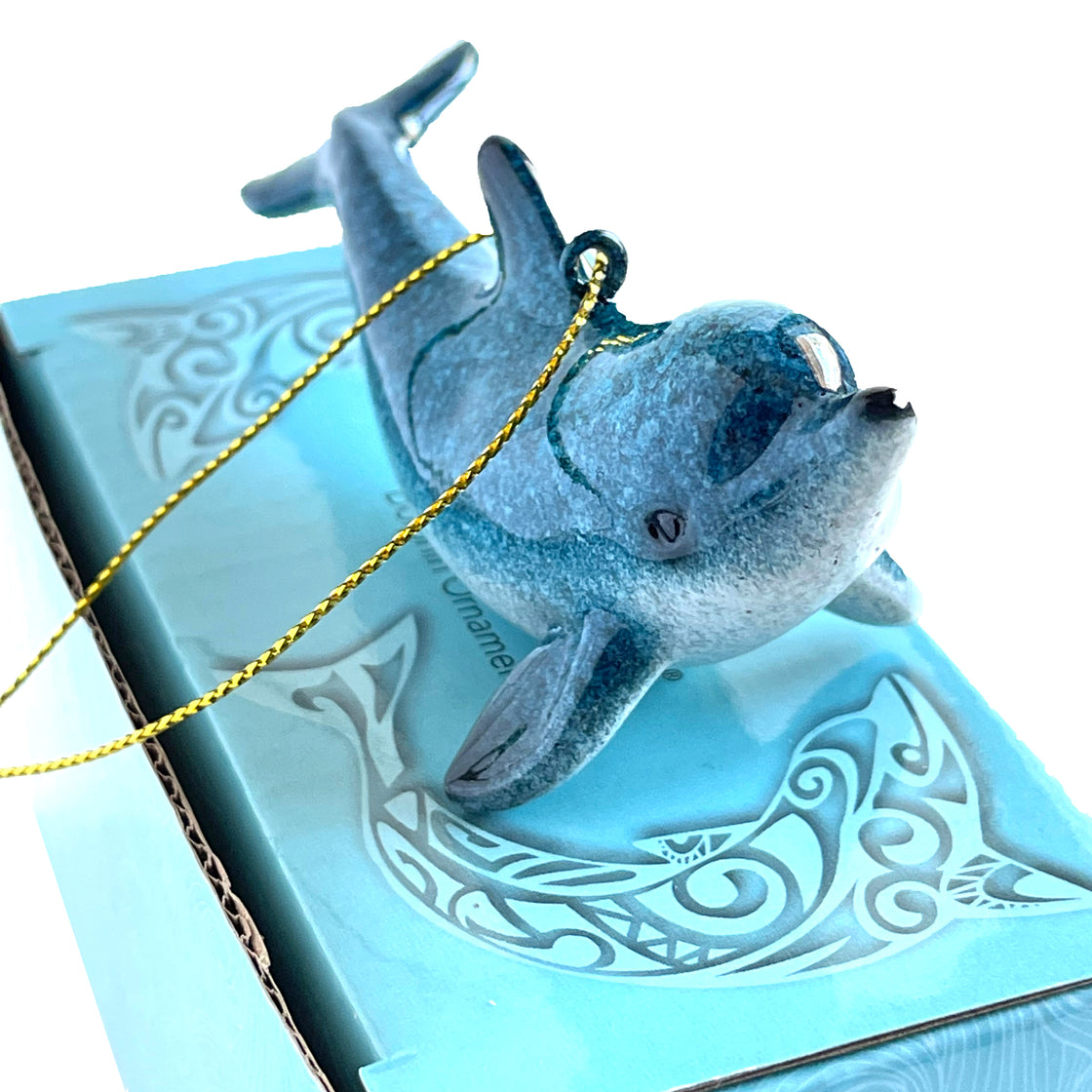 Artful hand-painted rengora blue dolphin ornament seated on its own package