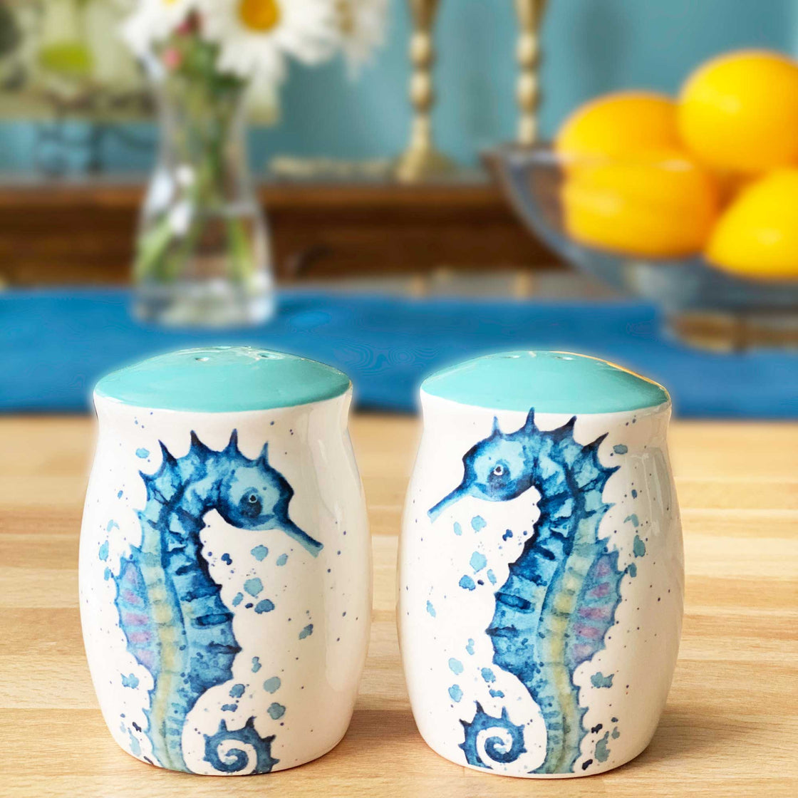 rengora seahorse salt and pepper shakers on table with lemons and daisies in the background