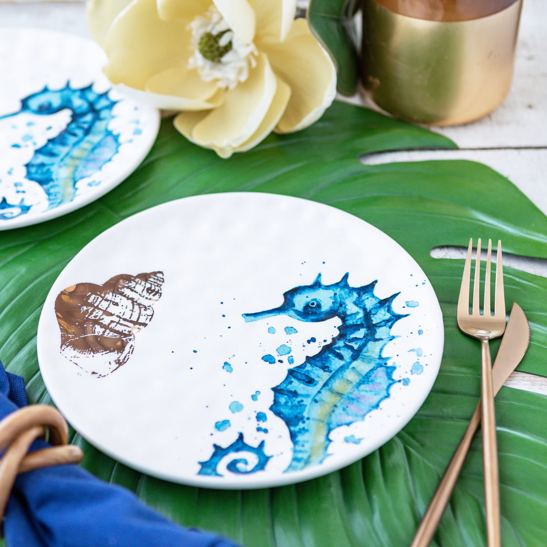 closeup of blue and green seahorse with gold shell plate - handwash recommended