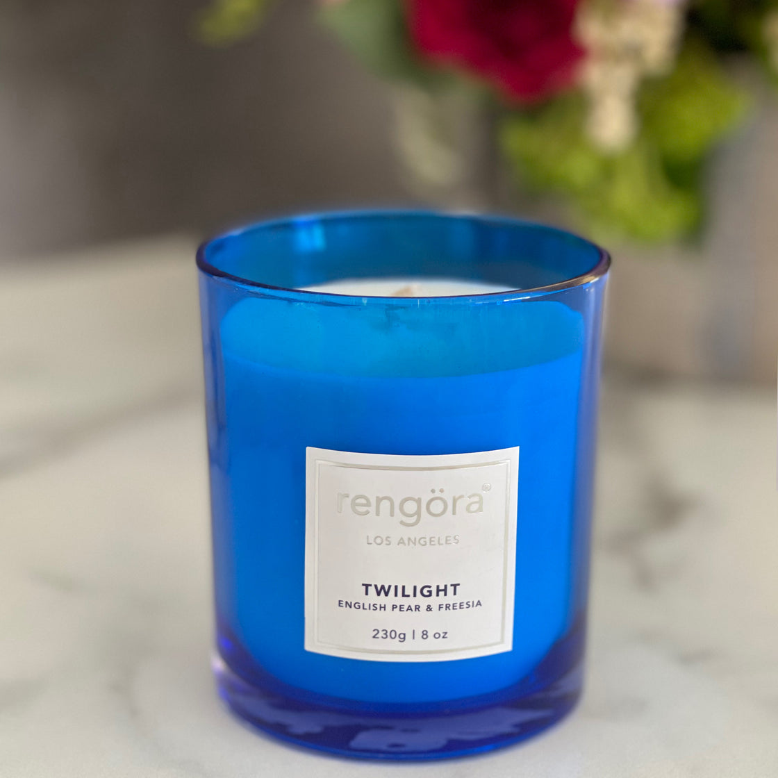 blue glass 8 oz. English pear and freesia scented soy wax candle