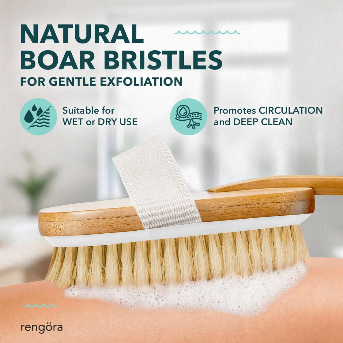 Natural boar bristle exfoliating body brush being used on skin with foam, promoting circulation and gentle exfoliation