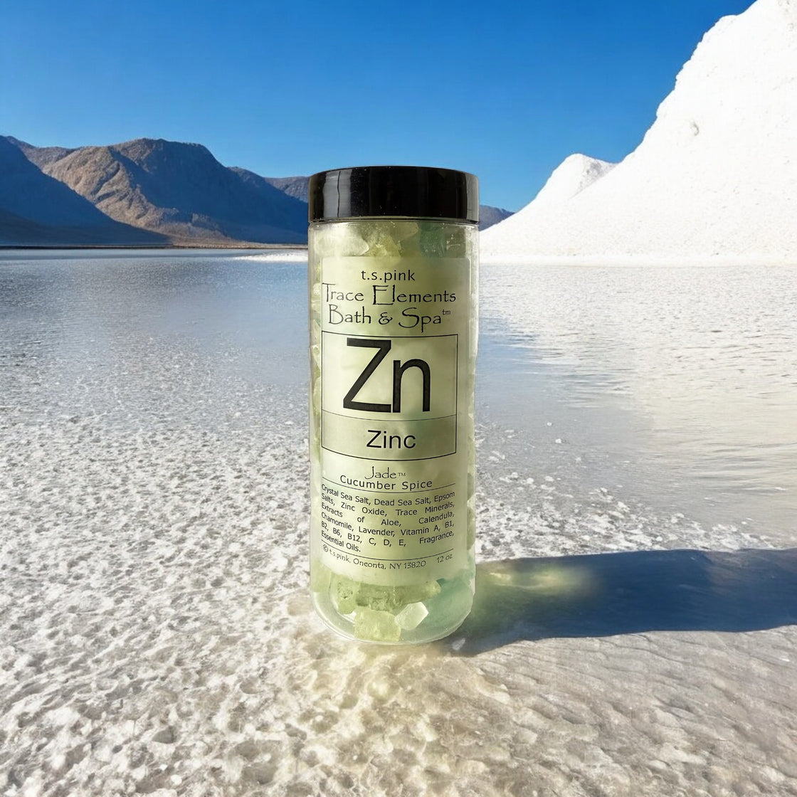 A jar of Rengöra bath salts infused with zinc stands in the middle of a salt lake, surrounded by mounds of salt.