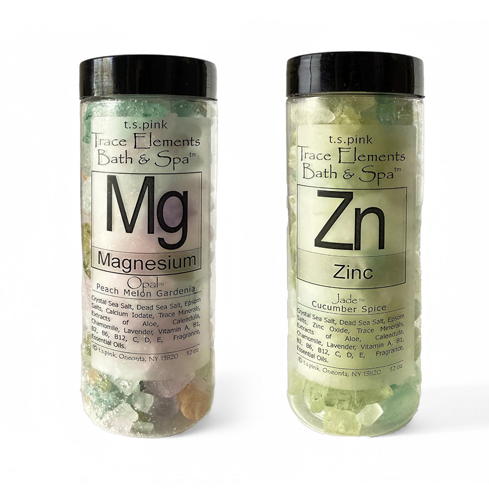 Image of a bath salt set featuring "Magnesium Bath Salts" and "Zinc Bath Salts" in elegant clear jars with minimalist black lids. 