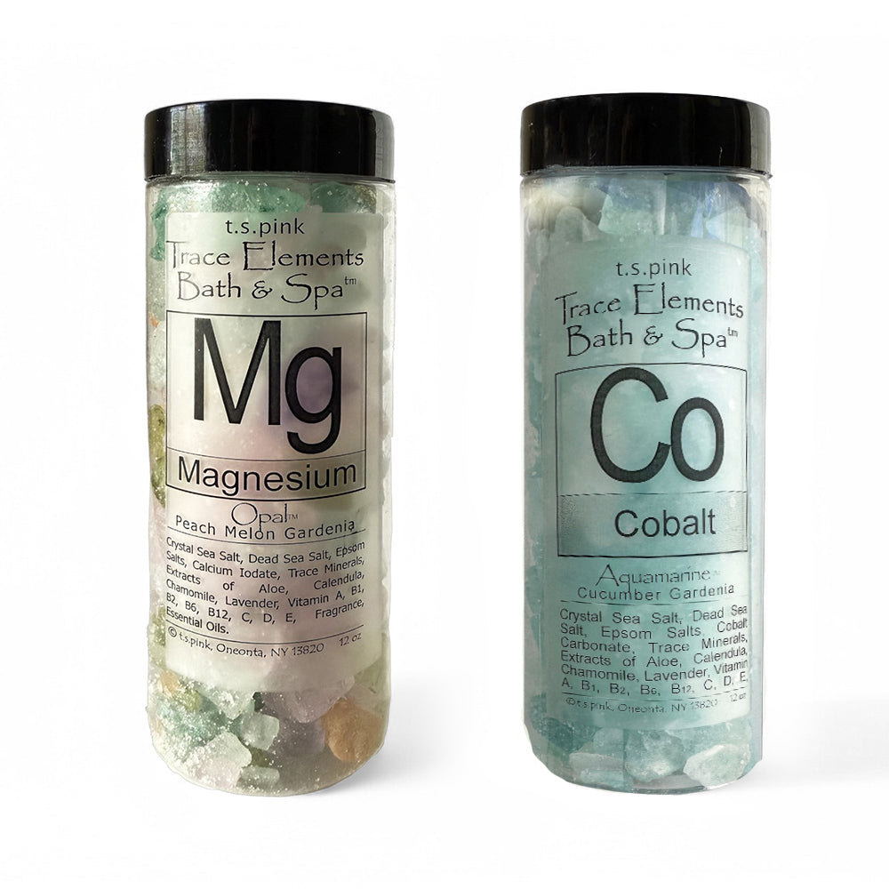 Image of two luxurious bath salts: one with vibrant aqua-blue crystals labeled "Cobalt Bath Salts" and another with mineral-rich colorful salts labeled "Magnesium Bath Salts." The sleek, modern packaging features clear jars with black lids, showcasing the premium salt blends inside. A perfect spa-like set designed for relaxation and muscle recovery.