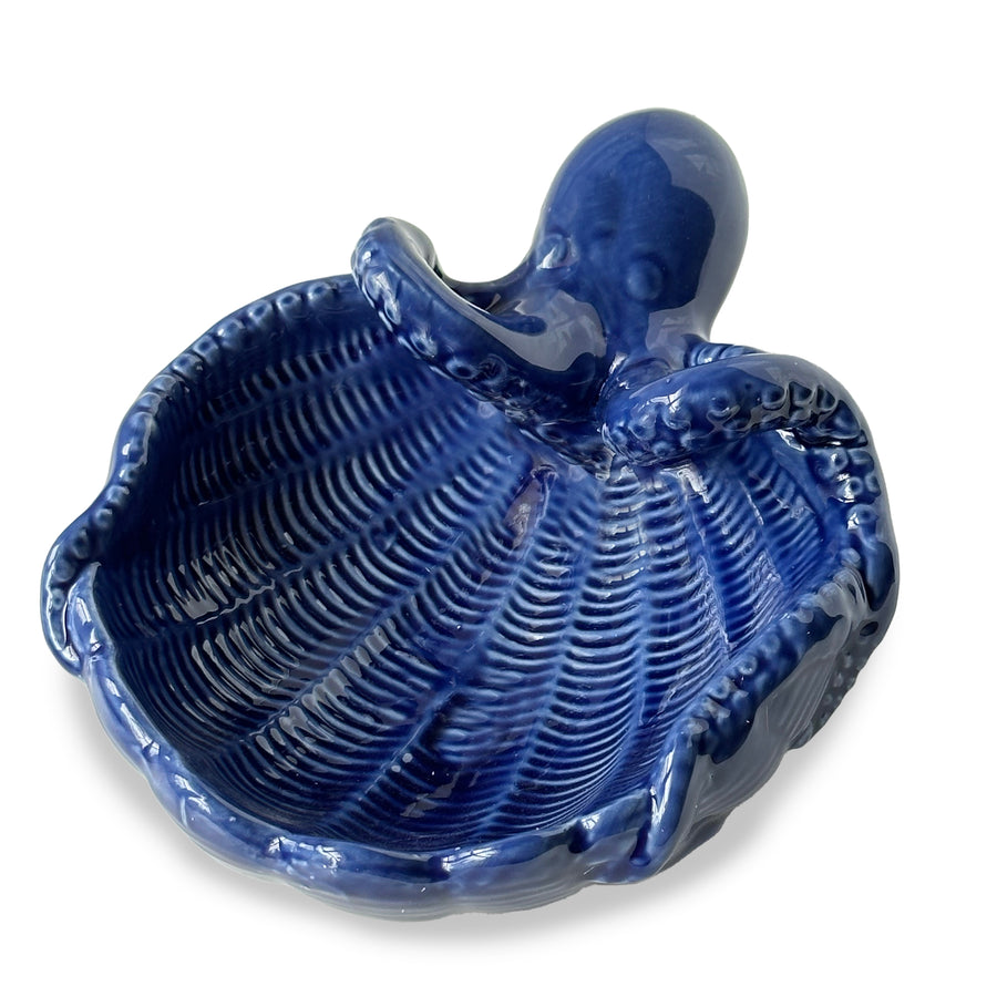Detailed view of blue ceramic trinket dish with octopus accent and ribbed seashell design