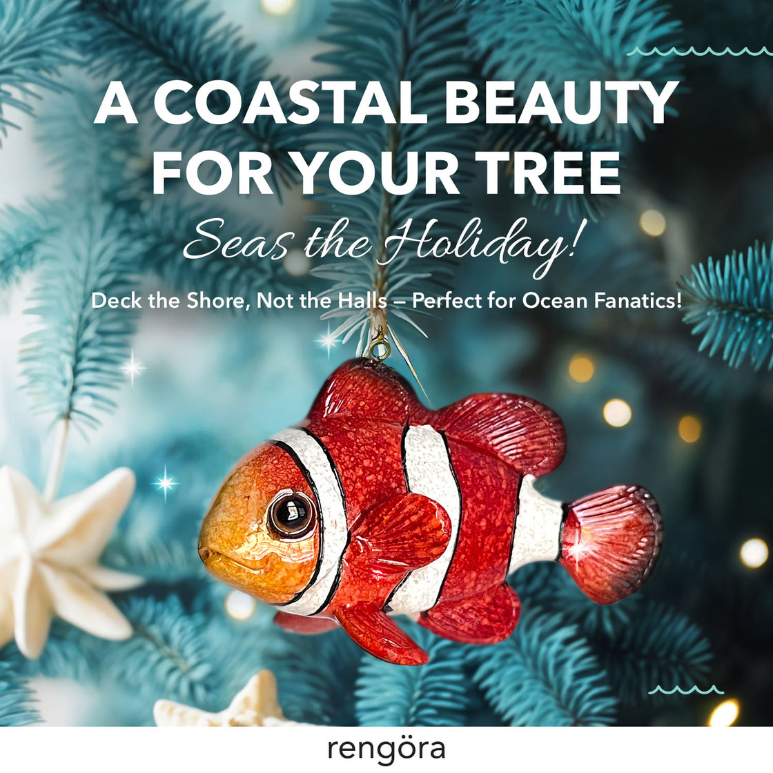 A brightly colored clownfish ornament with orange and white stripes hangs from a teal-toned Christmas tree branch.