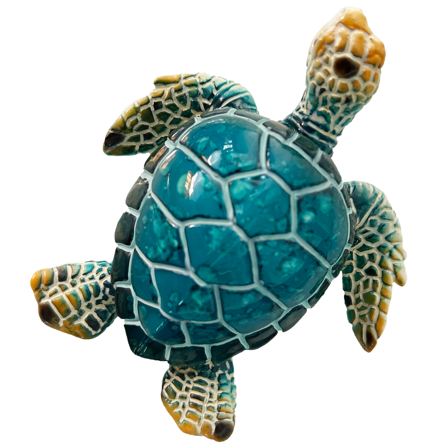 This small, decorative magnet features the likeness of a turtle, painted in a pleasing shade of deep turquoise / teal blue. Its smooth, glossy surface and well-defined turtle shape give it a delightful and eye-catching appearance by rengora