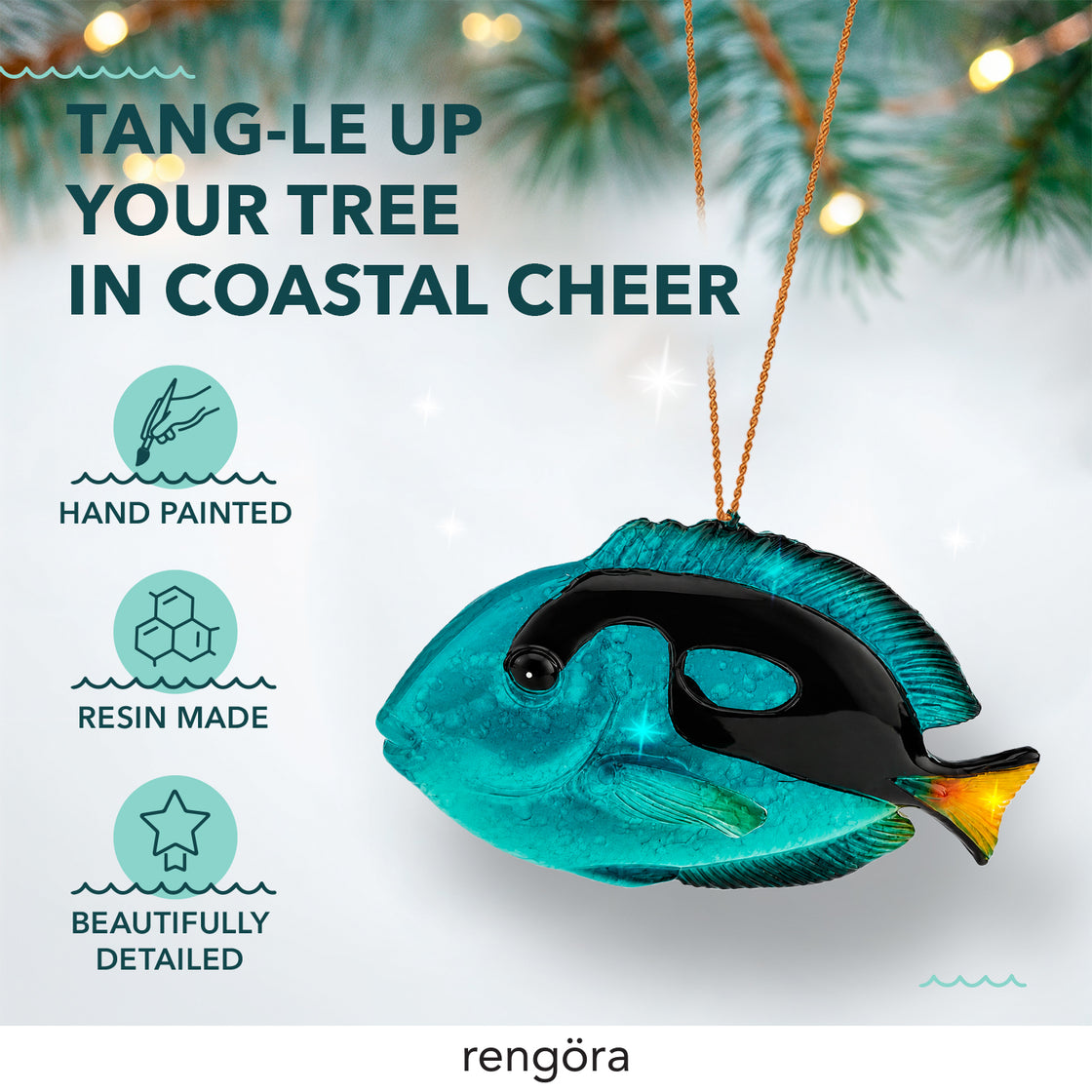 Rengöra blue tang Christmas ornament hanging from a gold cord with hand-painted resin details against a softly lit holiday background.