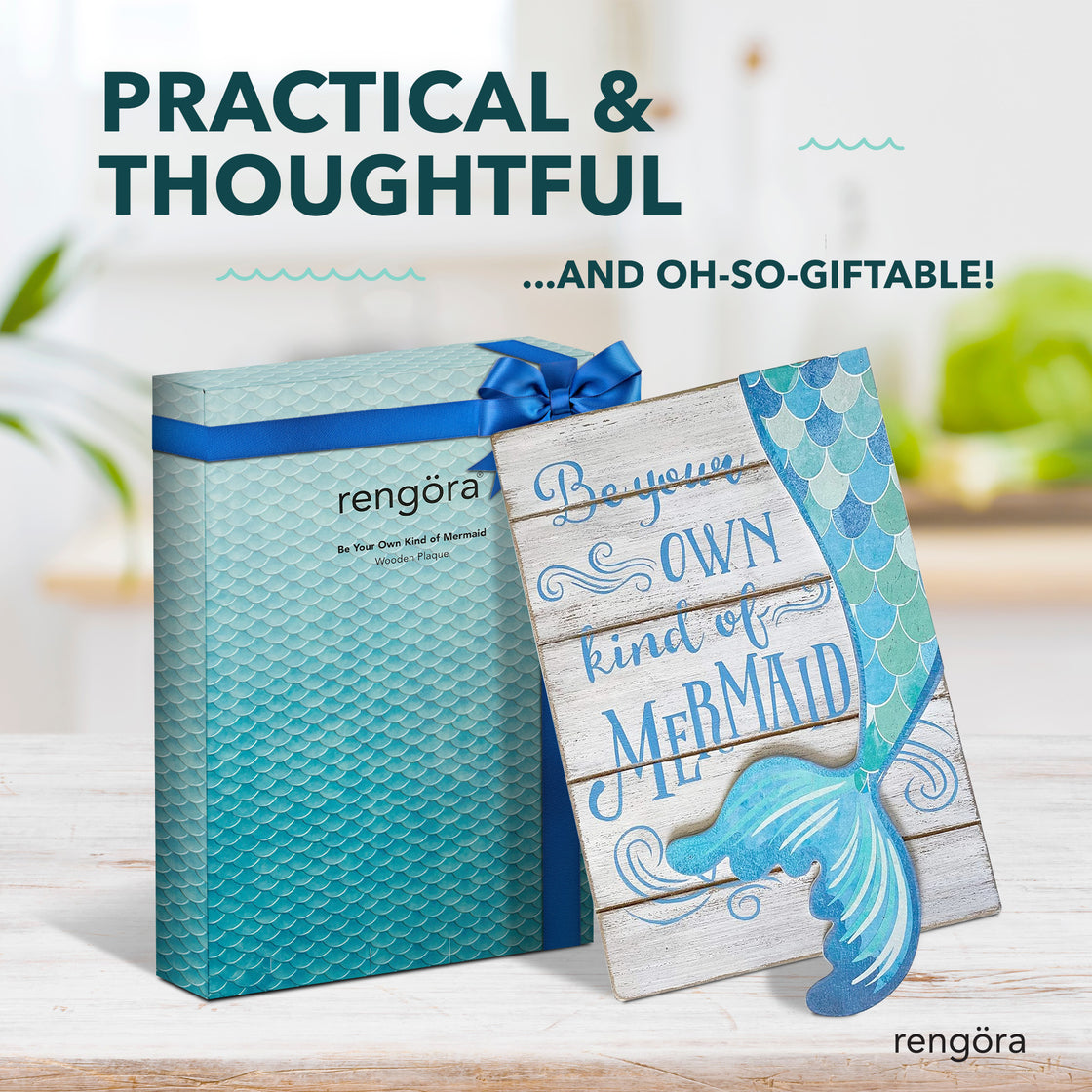 Mermaid-themed wooden plaque with the phrase “Be your own kind of mermaid,” displayed next to a matching Rengöra gift box with blue ribbon, under the text “Practical & Thoughtful… and Oh-So-Giftable!