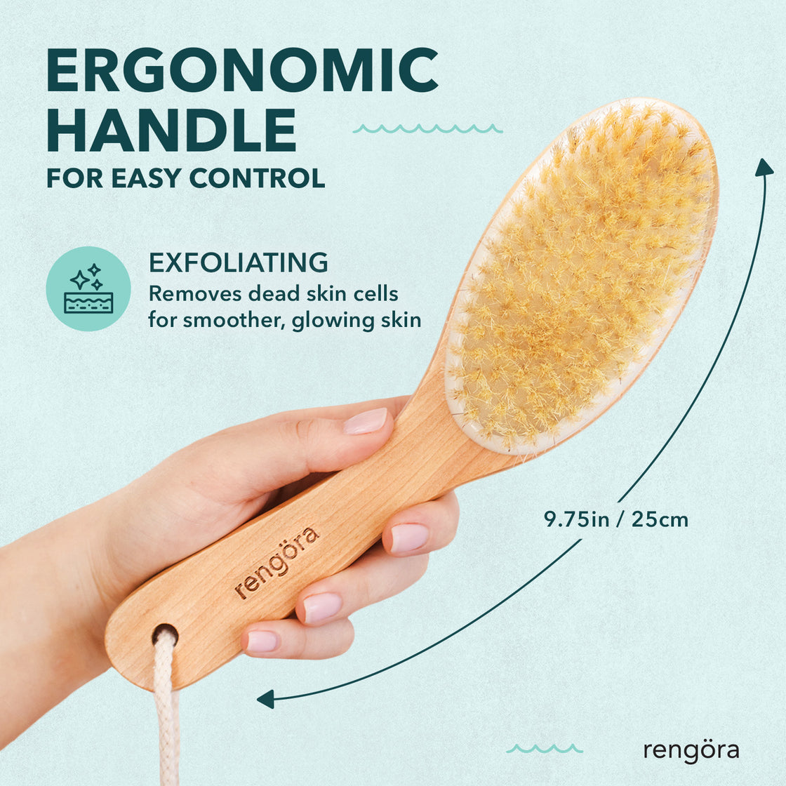Hand holding Rengöra cherry wood dry brush with ergonomic 9.75-inch handle; bristles shown for gentle exfoliation and glowing skin.