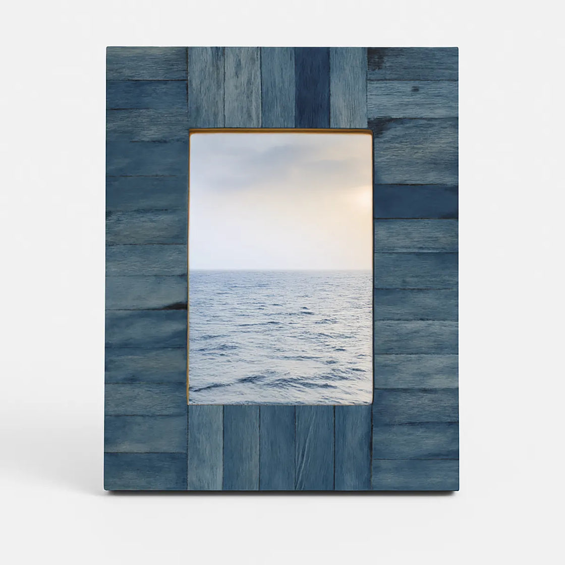 Rengöra ocean blue wooden picture frame made from handcrafted wood panels on white background