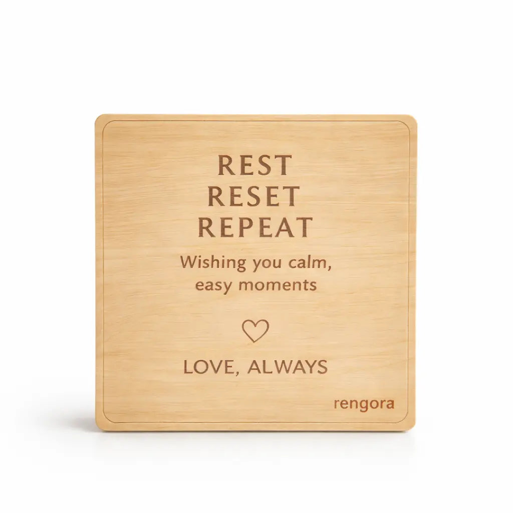 Wooden plate with engraved text on a white background