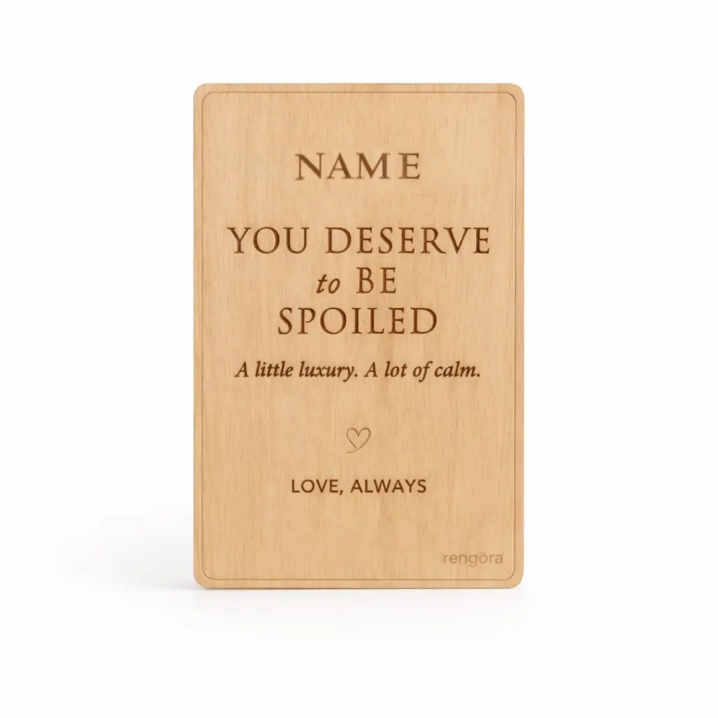 Wooden card with engraved Valentine's Day message on a white background
