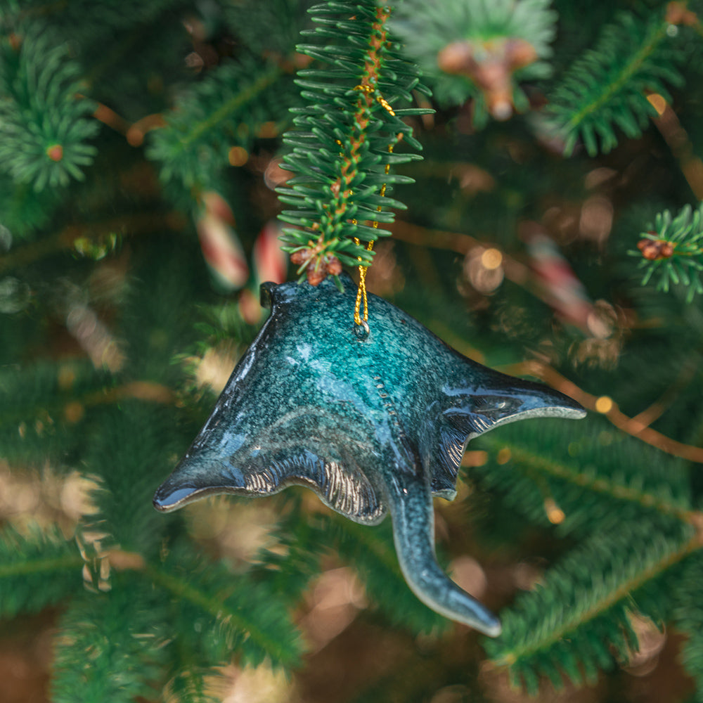 A detailed close-up of a hanging rengora manta ray ornament adorning a Christmas tree