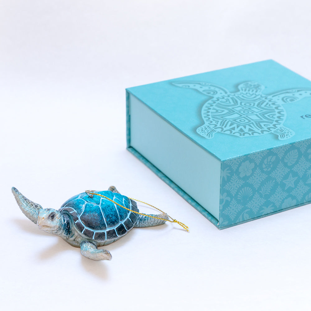 rengora's blue sea turtle Christmas tree ornament - part of a collection of ocean-inspired keepsake ornaments pictured next to its customized gift box