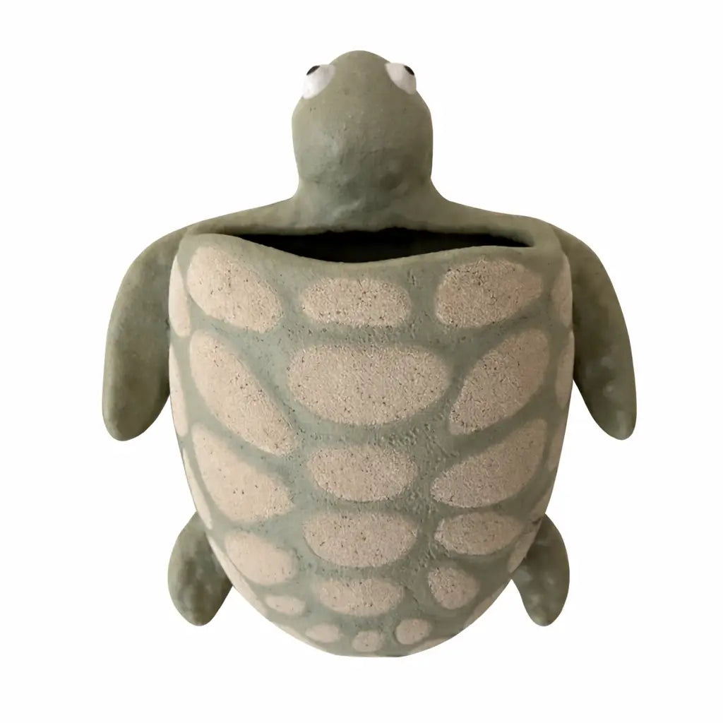 Tortoise-shaped ceramic planter on a white background