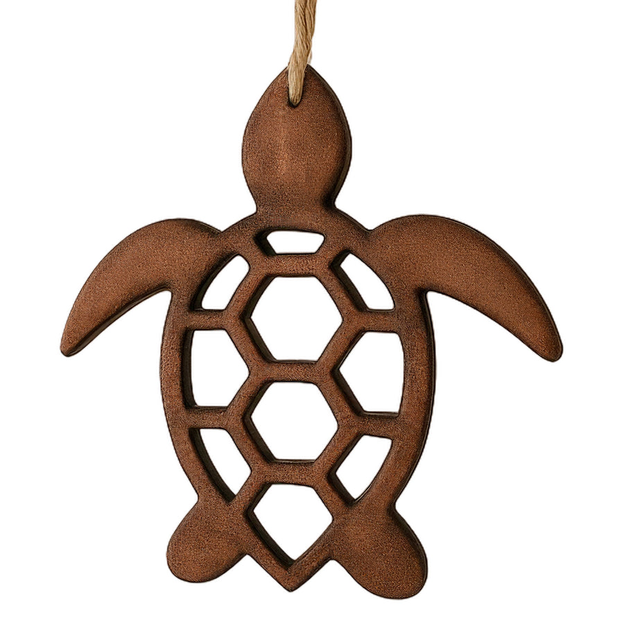 Wooden turtle ornament hanging on a white background