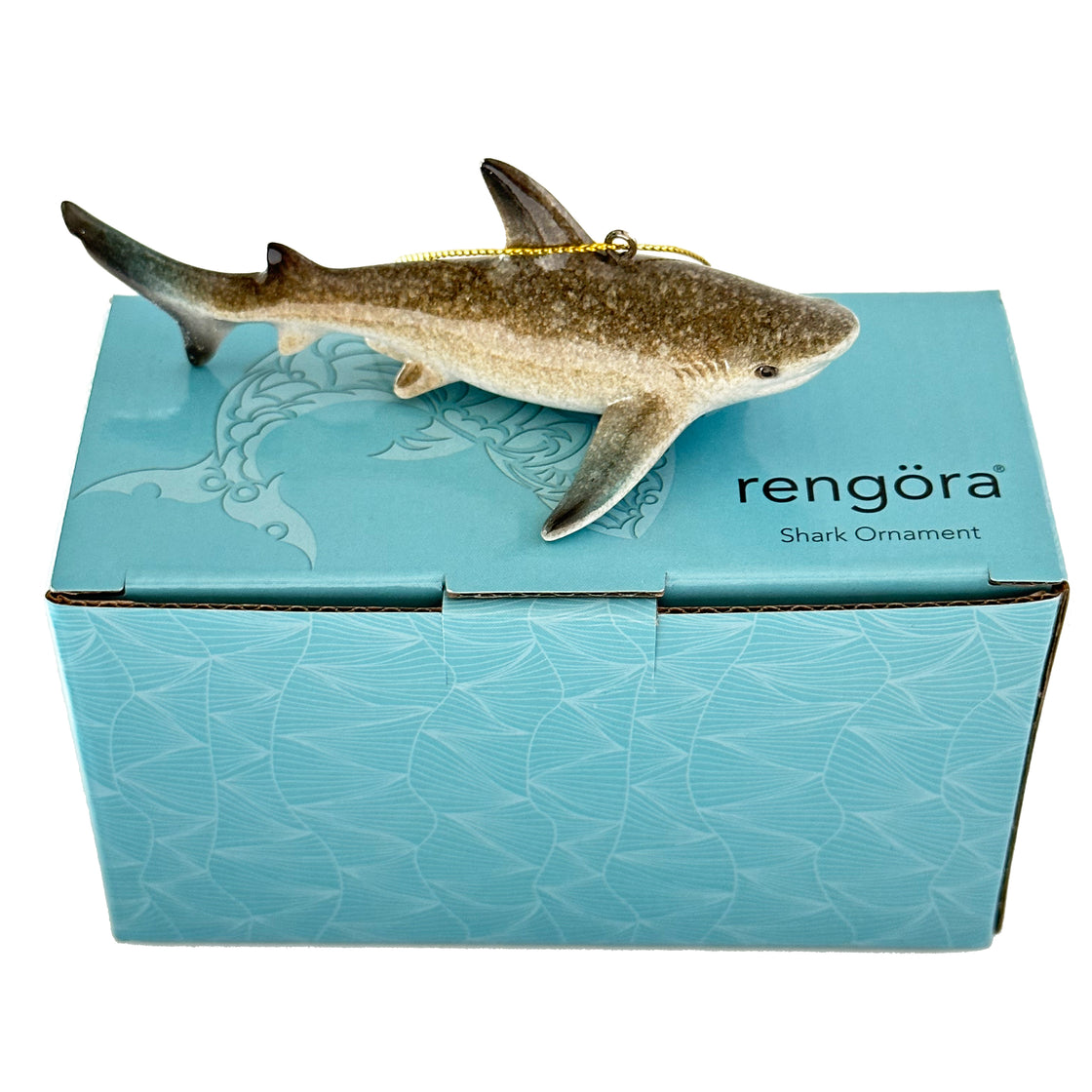 A rengöra shark ornament comes in its distinctive packaging adorned with a shark-themed design