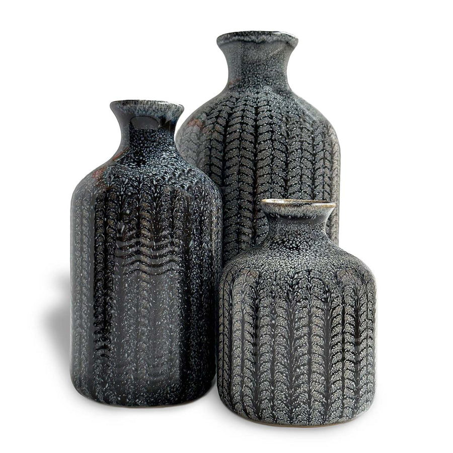 This Vase Set draws inspiration from the ocean's depths and is meticulously crafted with an elegant touch against a clean white background
