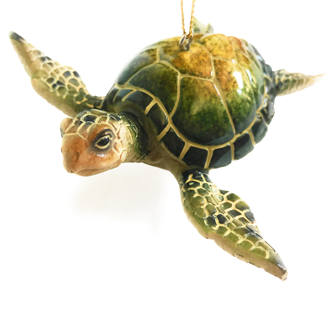 close up view of green sea turtle ornament on white background by rengöra
