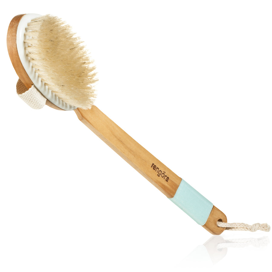 dry brushing body brush by Rengora with a soft teal blue rubberized handle