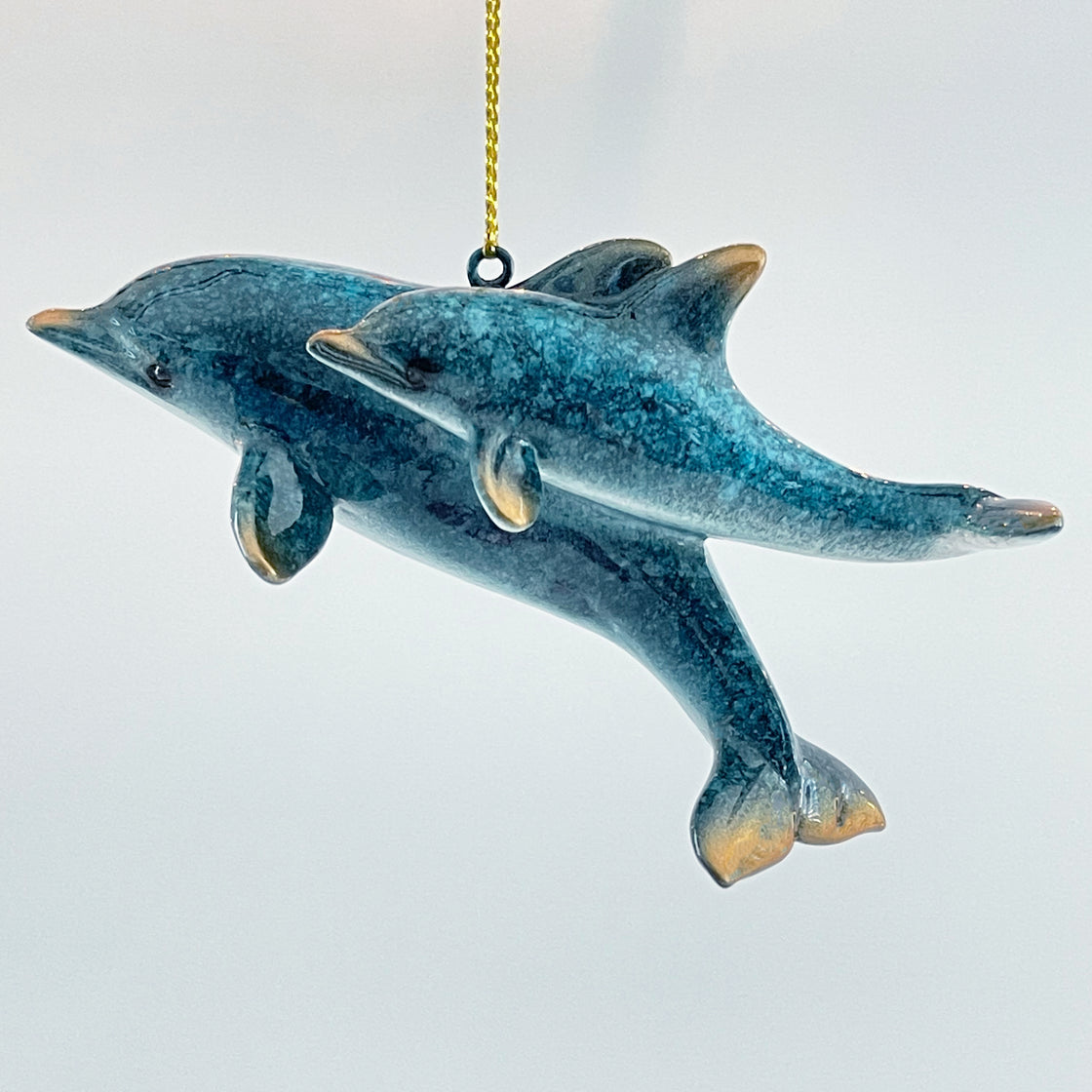 rengöra  dolphin Christmas ornament (mother with calf) on a plain white background.