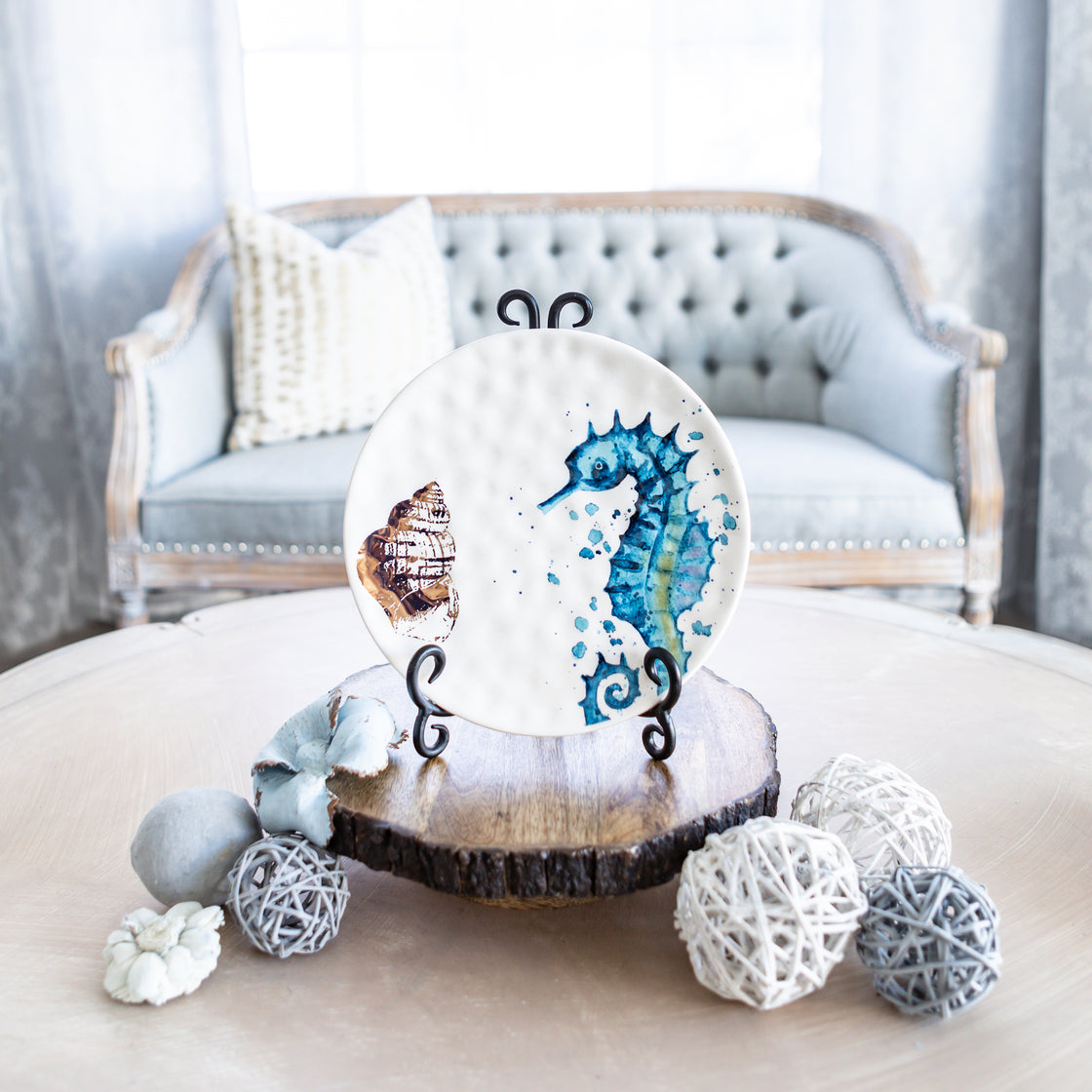 beautiful decorative ocean decor blue seahorse plate pictured on living room table